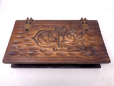 A wooden jewellery box in the form of a book containing a quantity of costume brooches