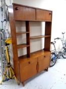 A mid century teak wall unit / room divider