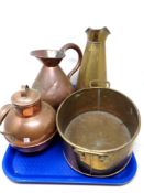 A tray of two copper jugs,