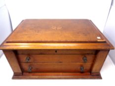 An inlaid two drawer cutlery canteen containing an EPNS cutlery service