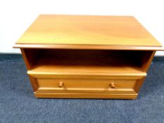 A teak entertainment stand