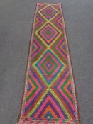 A Suzni kilim runner 293cm by 76cm