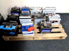 A pallet containing eleven assorted car batteries including Varta, Bosch, RAC etc.