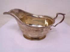 A silver sauce boat, Birmingham marks.