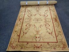 A pair of contemporary floral patterned woolen rugs on golden ground