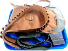 A tray of leather cartridge belt, canvas gun case,