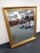A gilt framed bevelled overmantel mirror
