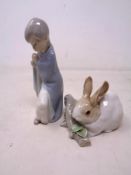 A Lladro figure of a girl in a blanket,