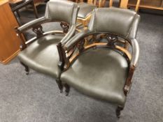 A pair of Edwardian tub armchairs in green vinyl