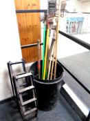A plastic bin containing a quantity of garden tools, Black and Decker hedge trimmer,