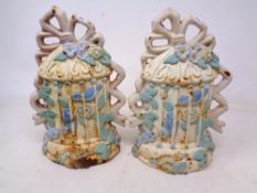 A pair of painted cast iron door stops