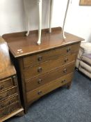 An Edwardian inlaid mahogany four drawer chest