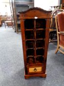 A stained pine wine rack fitted a drawer