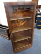 A 20th century oak glazed door bookcase
