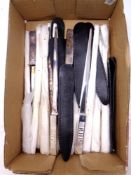 A box of metal letter openers