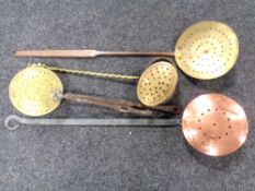 A box of copper and brass chestnut roasters