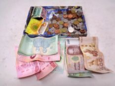 A quantity of world coins and banknotes