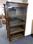 An Edwardian oak four tier stacking bookcase