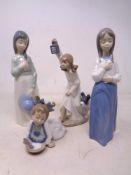 Four Nao figures of girls