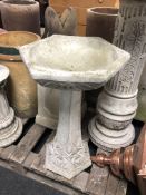 A concrete Art Nouveau style bird bath