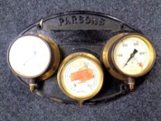 A cast iron wall plate marked Parsons Heaton Newcastle upon Tyne,