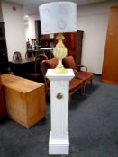 A painted plaster plant pedestal together with an alabaster table lamp with shade