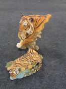 Two contemporary figures of tigers.