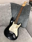 An Encore electric guitar