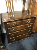 A reproduction oak five drawer chest.