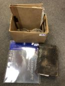 A small folio containing a collection of British stamps,