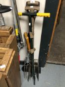 A bundle of garden tools including forks, sheers, hoes etc.