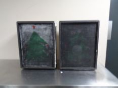 A Squire amplifier together with a pair of speakers.