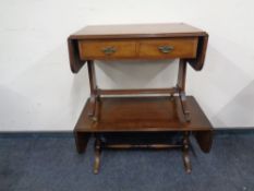 Two mahogany flap sided low tables.