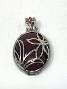 A silver mounted pendant locket