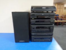 A Kenwood four-part stereo stack system with pair of speakers