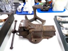 A vintage heavy duty Parkinson's number 5 bench vice together with a shoe last.