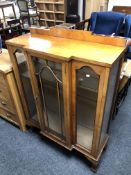 A walnut break fronted china cabinet.