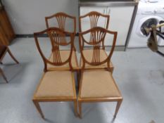 A set of four Edwardian beech dining room chairs.