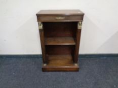 An Empire style mahogany bookshelf.