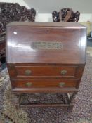 An Edwardian oak writing bureau