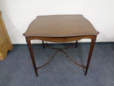 A Victorian mahogany centre table with under stretcher.