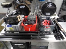 A quantity of stage lighting and electrical control units and stands, tambourine etc.