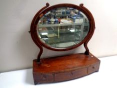 A George III mahogany dressing table mirror fitted a drawer