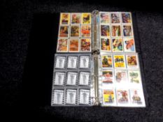 Two collector's albums containing John Wayne movie cards