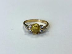An 18ct gold diamond and yellow sapphire ring,