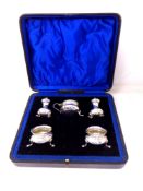 A five piece silver cruet set in case