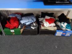 Four boxes containing fancy-dress costumes.