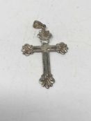 A silver crucifix pendant