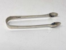 A pair of silver sugar tongs