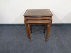 A nest of walnut tables.